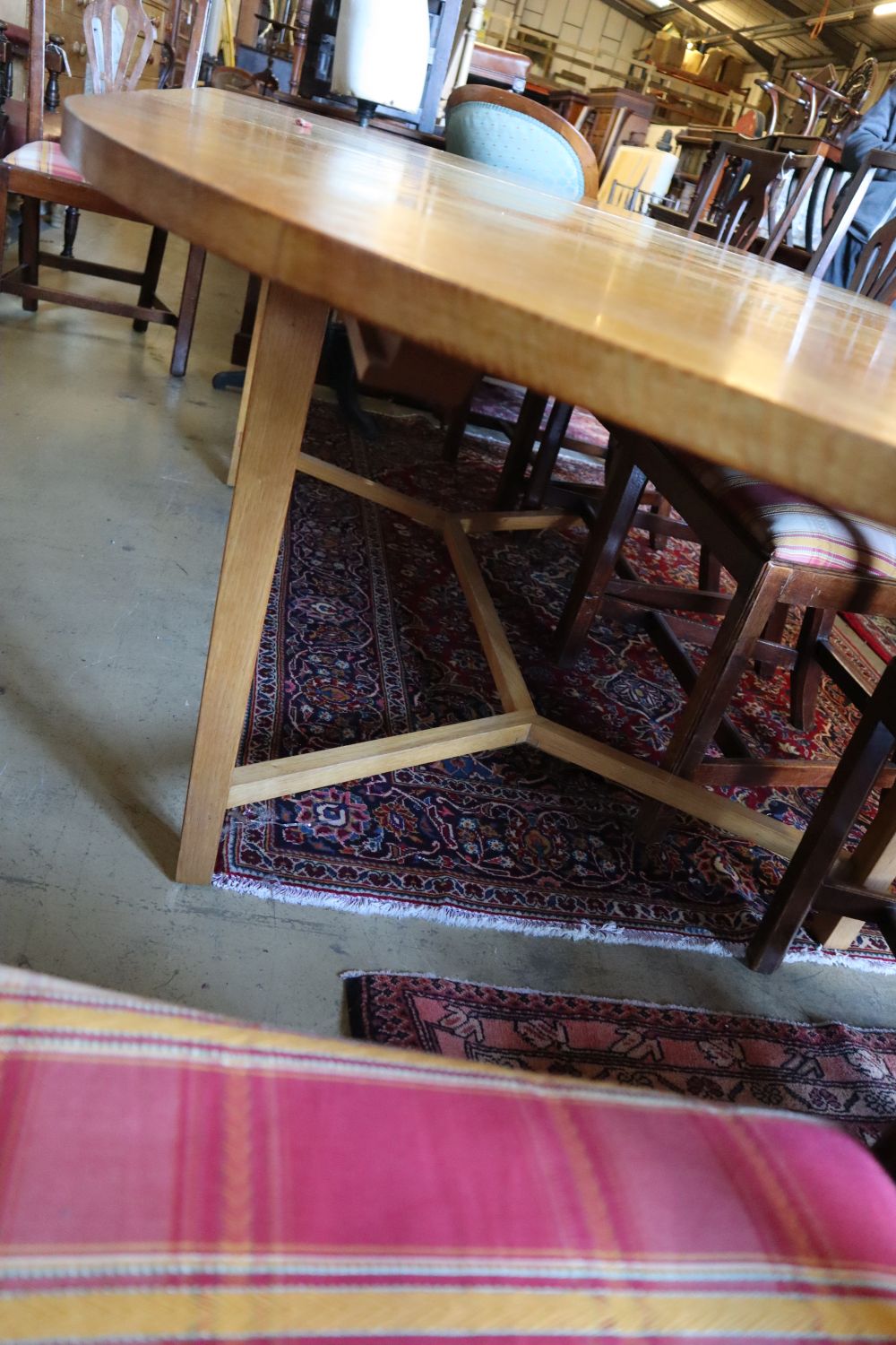 A contemporary oak extending dining table, length 240cm extended, depth 120cm, height